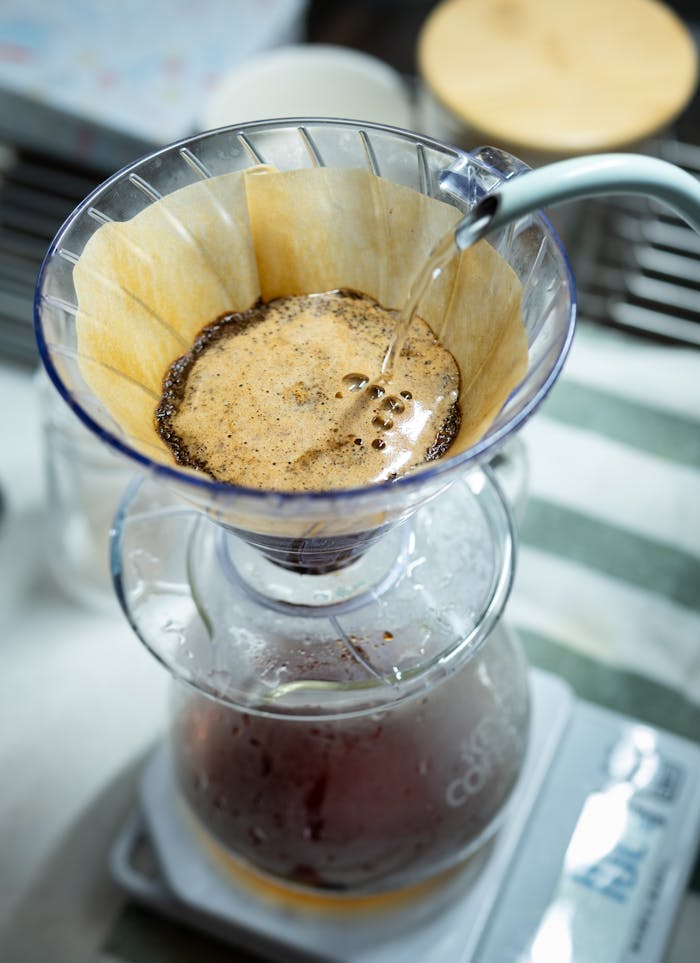 Captivating pour-over coffee creation in a Tokyo cafe, showcasing artisan brewing technique.